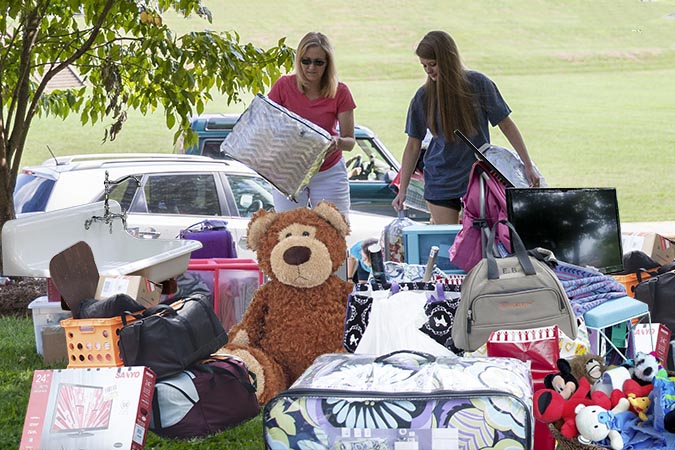 student with too much stuff for move-in