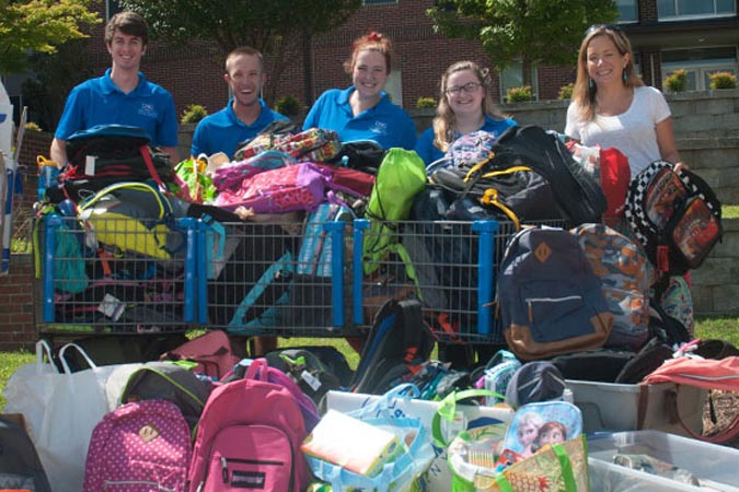 students with donations for community organization