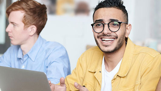 male students at computers