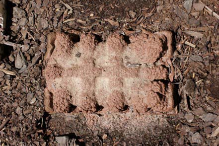 terracotta solid in shape of packaging mold on dirt