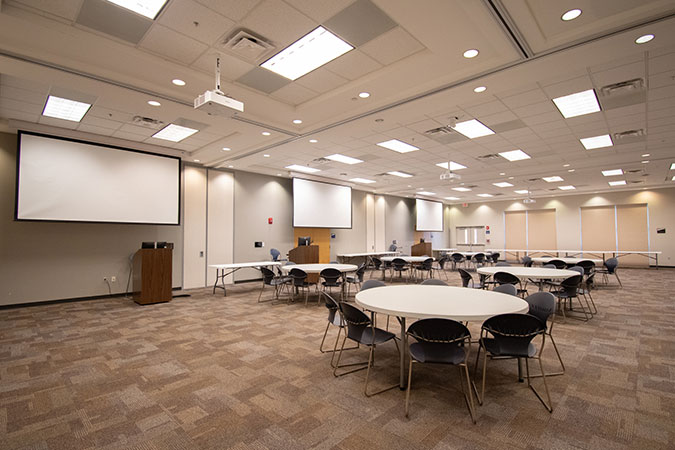 view of the robinson ballroom with round tables and chairs