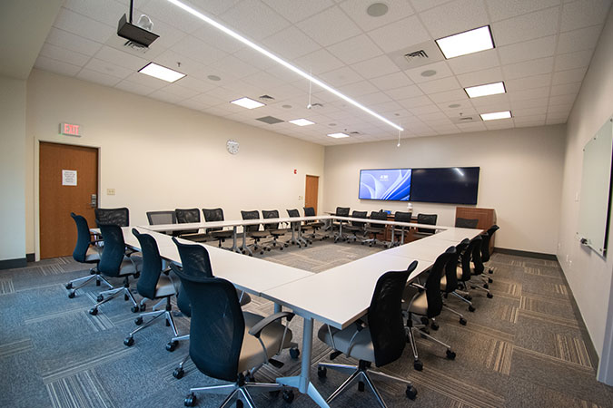 view of the conference room big square table configuration