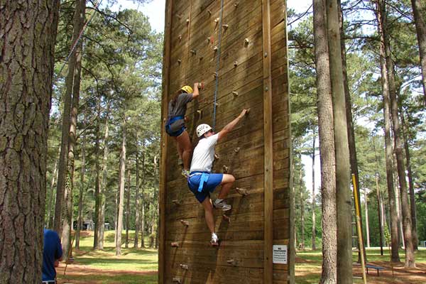 students on climbing wall 