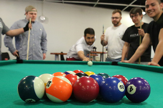 guys playing billiards