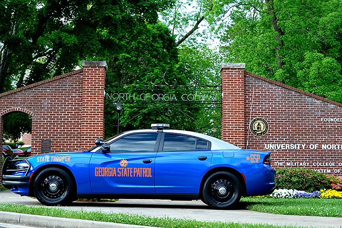 Georgia State Patrol car in front of UNG arch on Dahlonega campus.