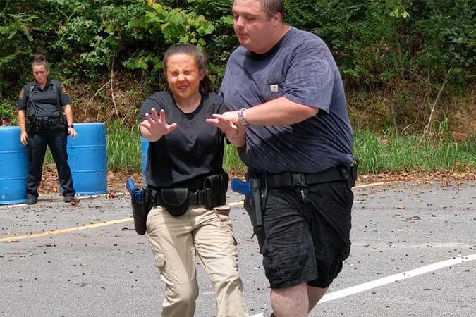 Students practicing with pepper spray