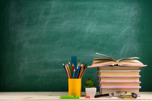 Chalkboard, books, and pencils