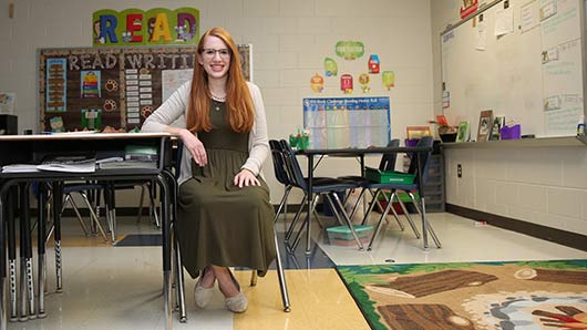 teaching alum in her classroom