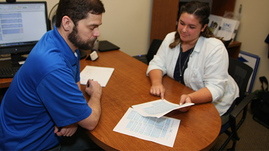  Staff working with student