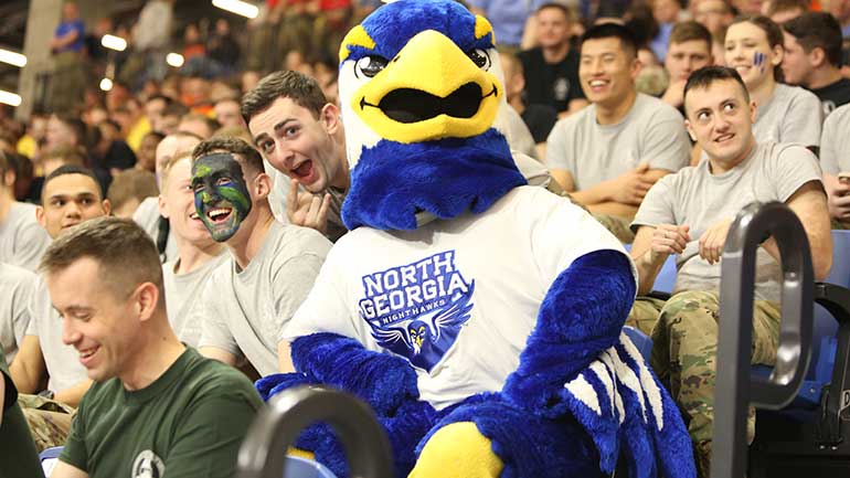 nigel and fans at basketball game