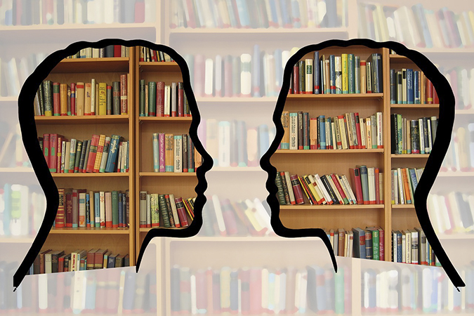 Head silhouettes talking against books in background. Go to Research Consultations.