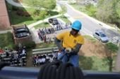 Students starting to rappel down cliff