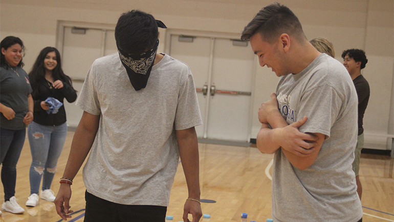 blindfolded student participating in a leadership activity
