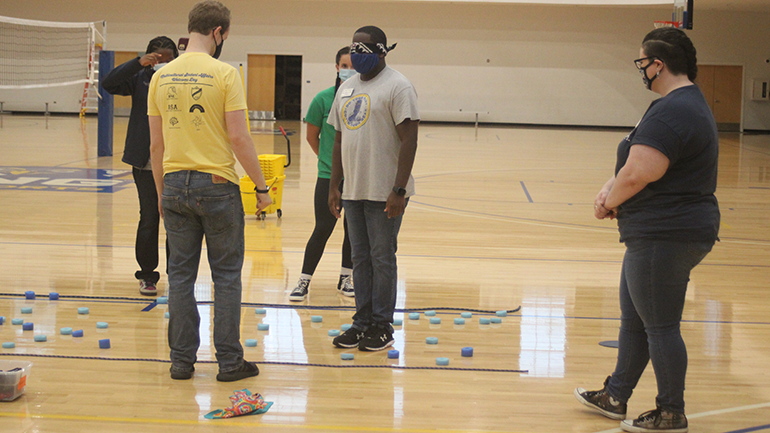 blindfolded student participating in leadership activity