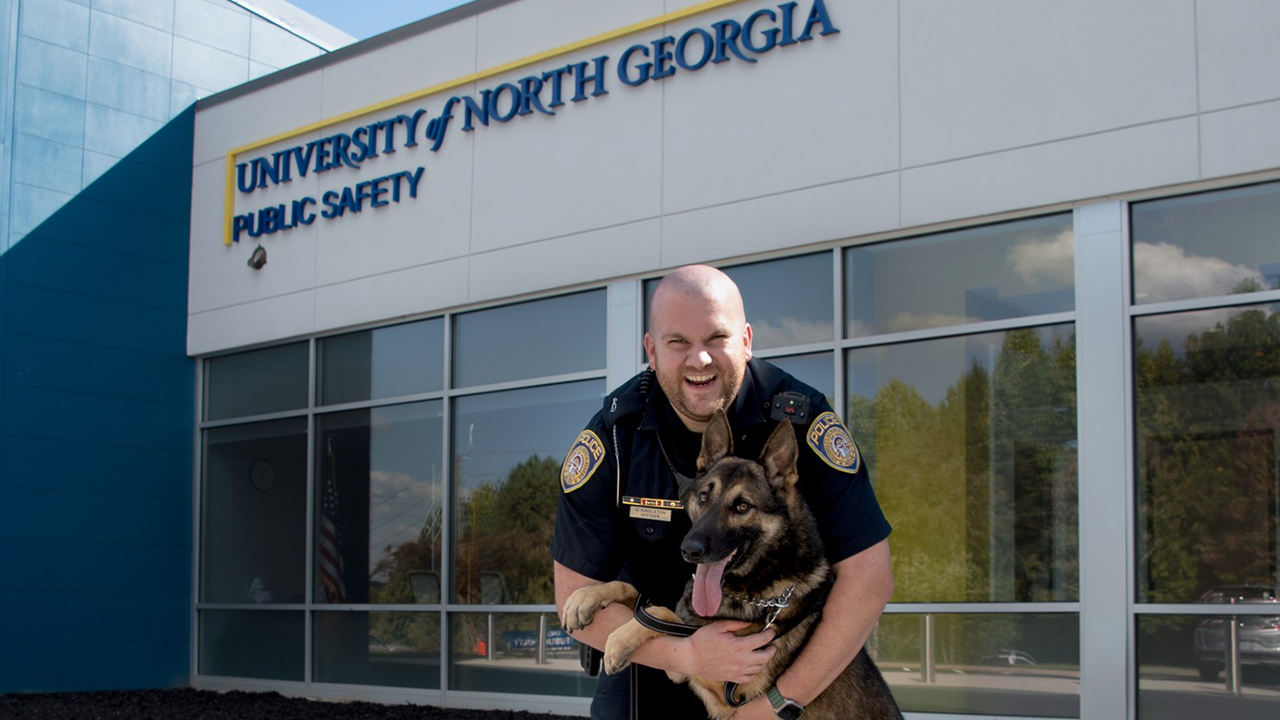 Rex, a 2-year-old German Shepherd-Belgian Malinois mix K-9, joined the UNG Police force in October.  He's shown here with his handler, Officer Dustin Singleton, at UNG Public Safety headquarters in Dahlonega.