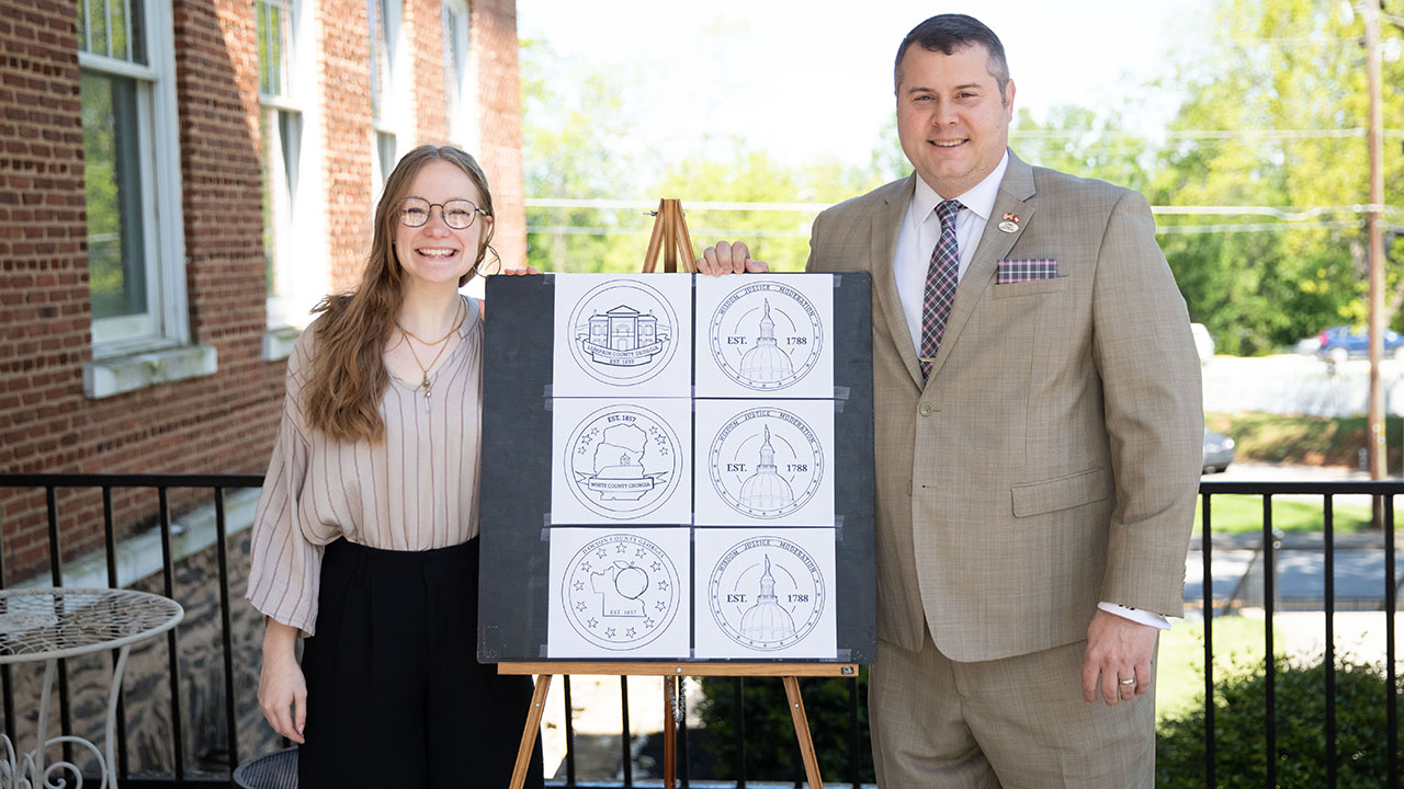 Student designs challenge coins for legislator