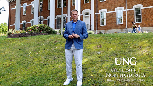 president shannon in front of Price Memorial building