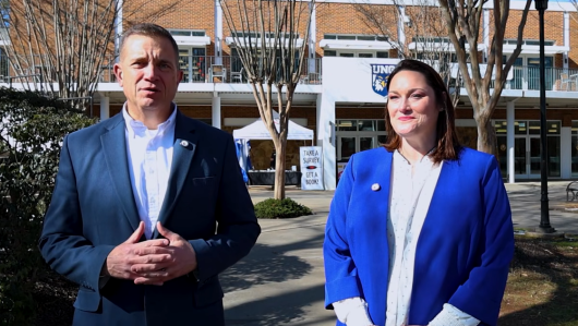 Shannon and Rodriguez outside talking