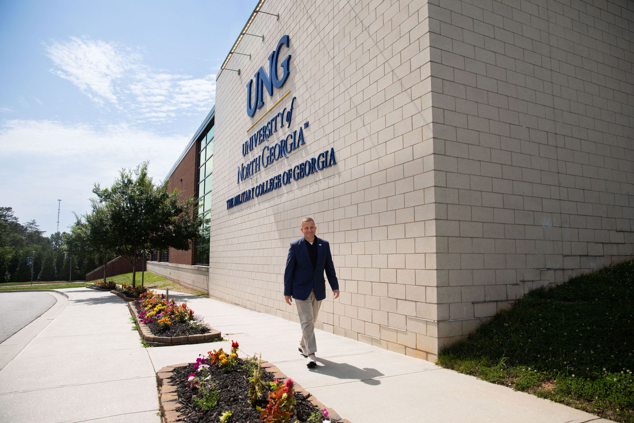President Shannon walking by the Convocation center