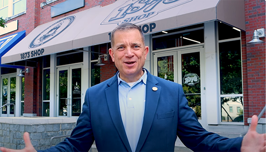 President Shannon in front of 1873 shop