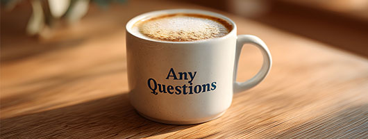 coffee cup that has the words  - any questions 