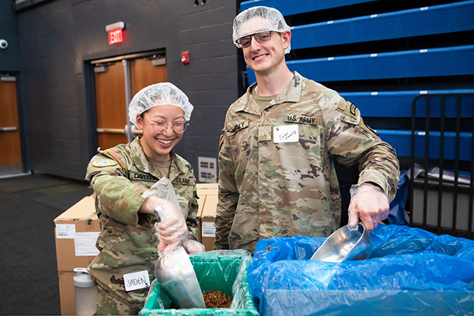two cadets volunteering at the 9/11 day of service