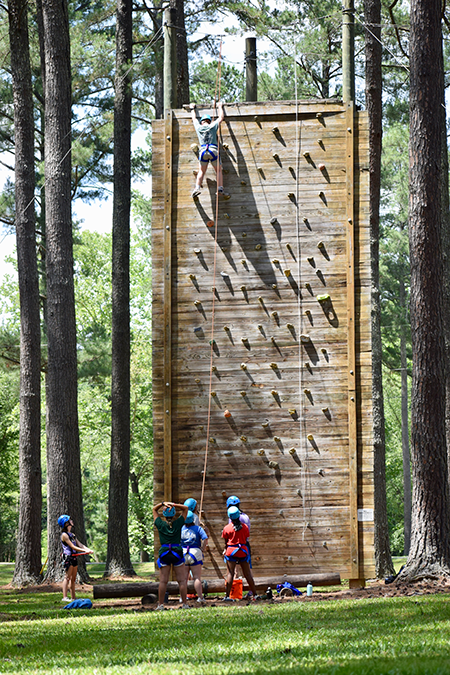 students at the climbing wall at Pine Valley