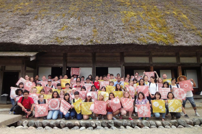 SLI Students posing in front of Japanese building